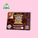 Dark Devil auto Seeds in plastic holder on a red paper with sweet seeds elephant logo and pink background and green Grow Island logo in the left corner